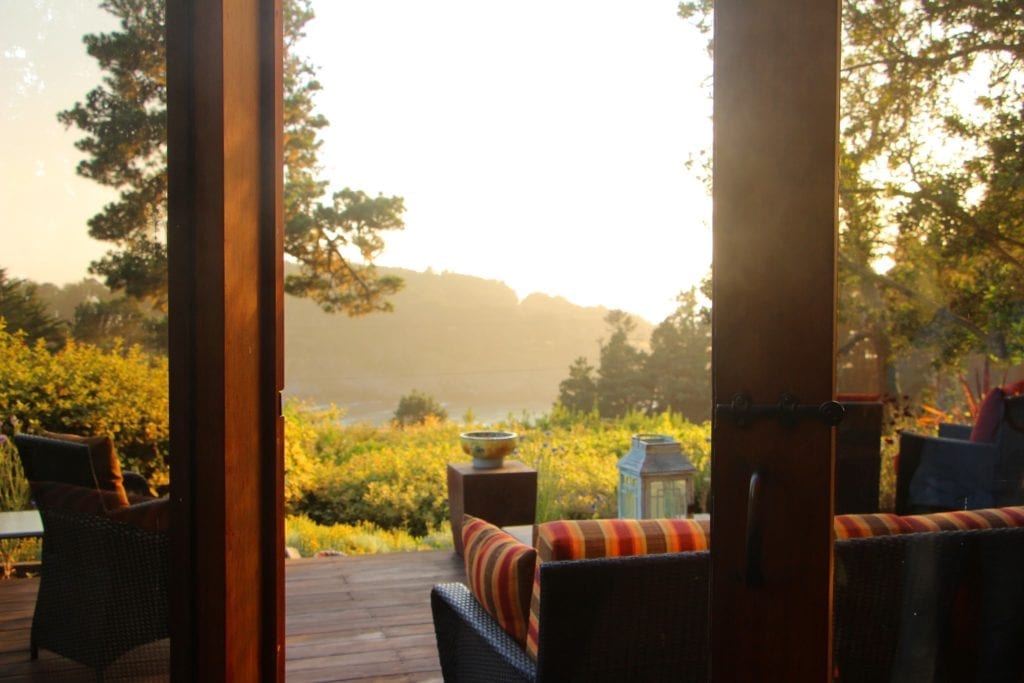 13-foot-tall French doors open from the great room onto the deck overlooking Smuggler's Cove.