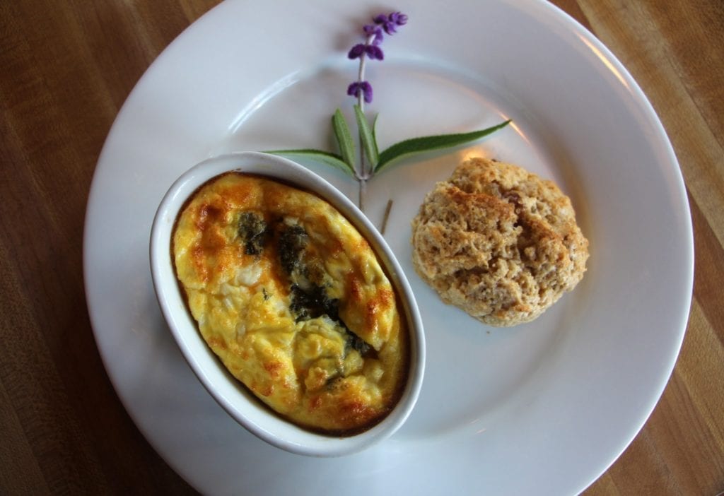 Baked pesto eggs served with a warm apple ginger scone