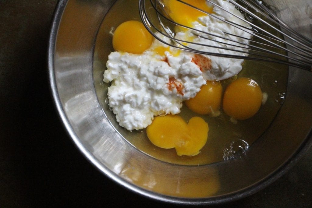 In a separate bowl, combine the eggs, yogurt, cottage cheese, salt and tabasco.
